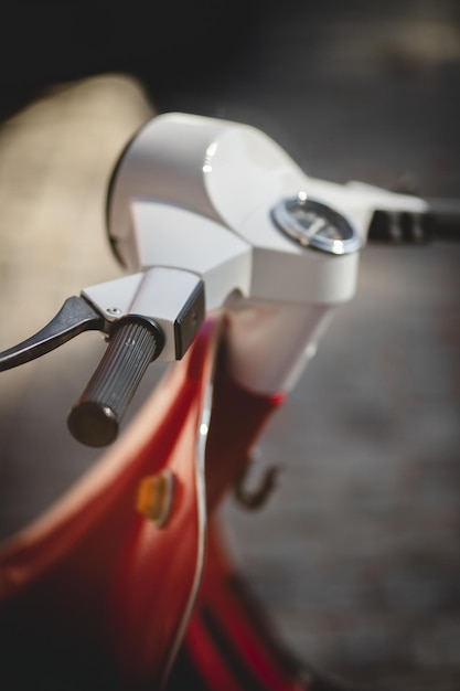 Steering wheel of a retro motor scooter close-up