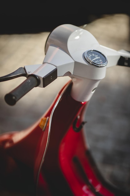 Steering wheel of a retro motor scooter close-up