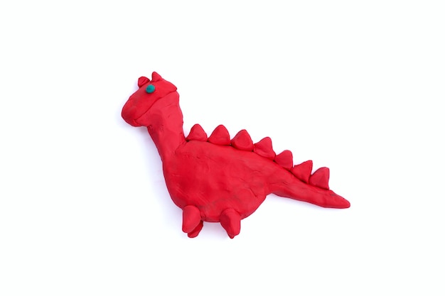 Stegosaurus made of plasticine on white background.