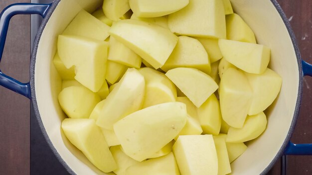 Step by step. Boiling potatoes for creamy mashed potatoes in dutch oven.