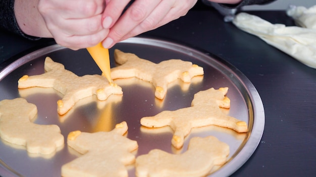 Step by step. Decorating unicorn sugar cookies with royal icing.