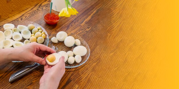 Step by step egg cut in half for making stuffed eggs