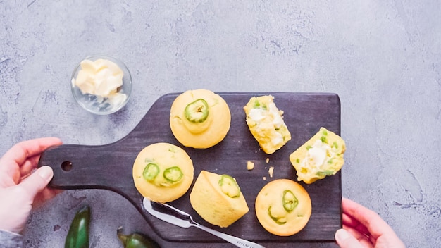 Step by step. Flat lay. Freshly baked slicy jalapeno cornbread muffins.