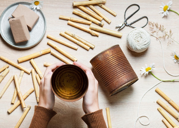 Step by step of making a bug hotel from upcycled food cans which have rusted in the weather