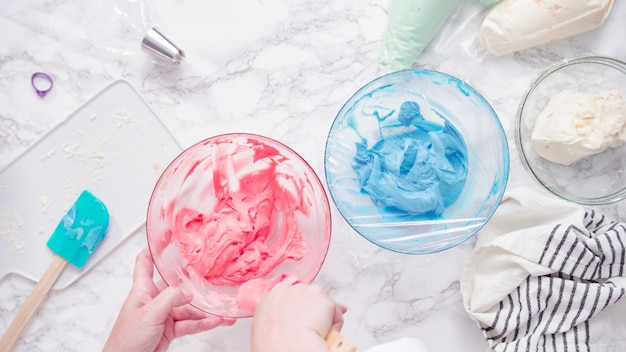 Step by step. Mixing food coloring with buttercream frosting.