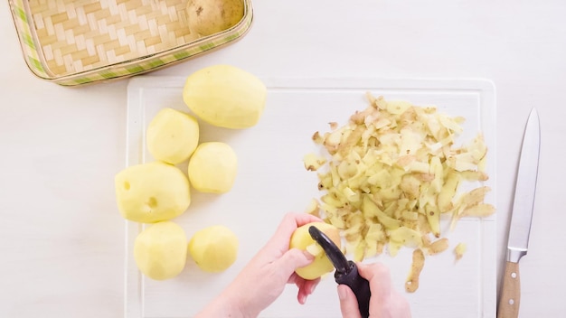 Step by step. Peeling Yukon gold potatoes for classic mashed potatoes.