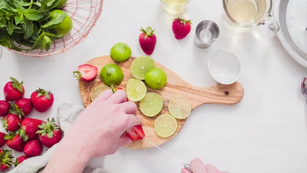 Step by step. Preparing strawberry margarita from fresh organic strawberries.