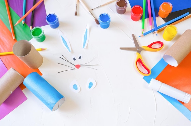 Step2 DIY paper rabbit from a roll of toilet paper Easy craft for kids on white background simple