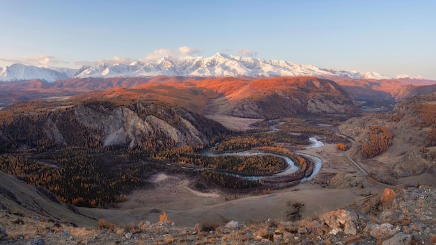 Steppe with winding river on the background of mountains