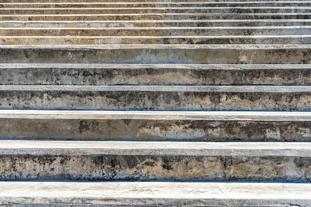 Steps of an old concrete staircase on a public walkway.