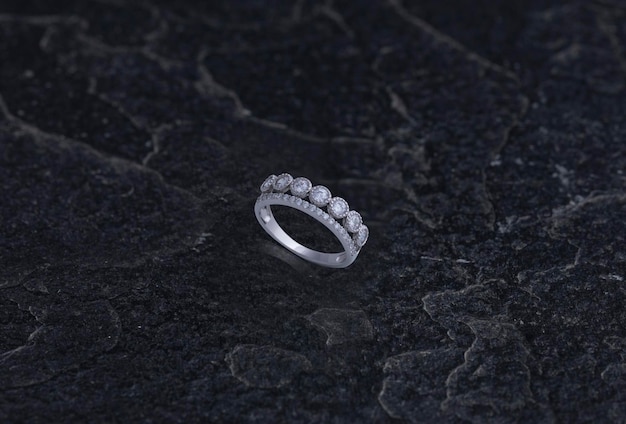 Sterling Silver Ring on Black Stone Background