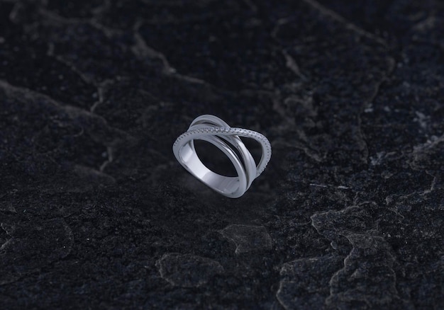 Sterling Silver Ring on Black Stone Background