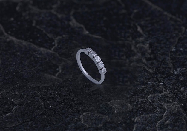 Sterling Silver Ring on Black Stone Background