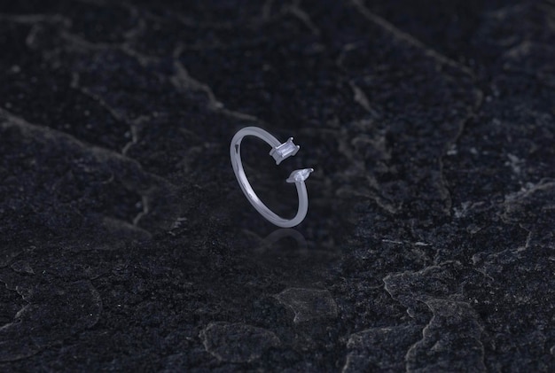 Sterling Silver Ring on Black Stone Background