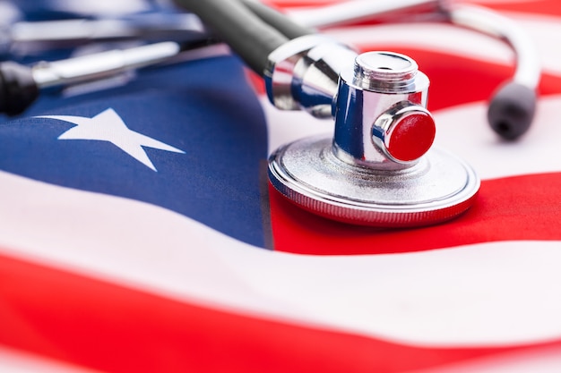 Stethoscope on American national flag, close up