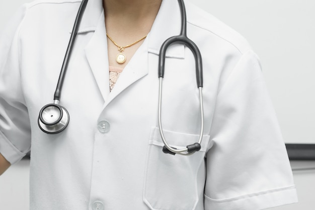 Stethoscope black are placed on the shoulders of doctor woman