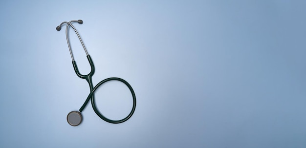 Stethoscope on blue background with copy space