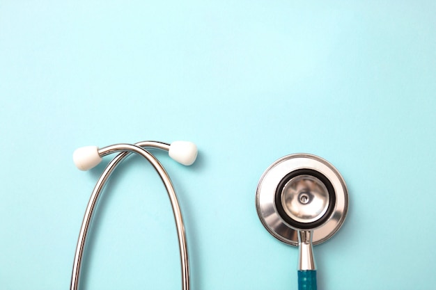 Stethoscope on blue background with copy space