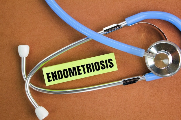 stethoscope and colored paper with the word endometriosis the concept of the female ovarian