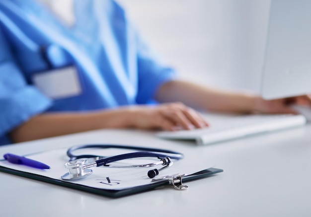 Stethoscope on desk Doctor working in hospital Healthcare and medical concept