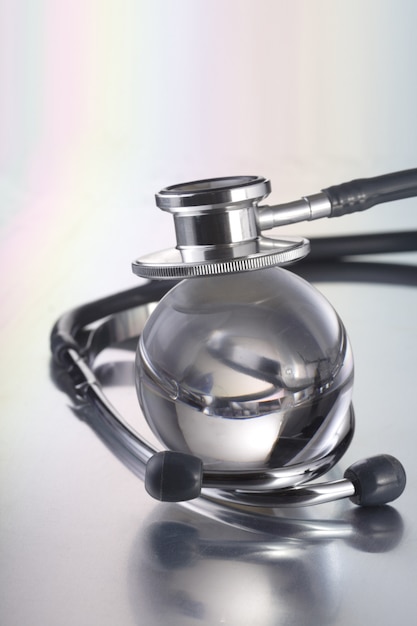 stethoscope on glass globe