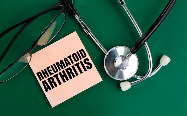 stethoscope and glasses with the word rheumatoid arthritis Medical concept