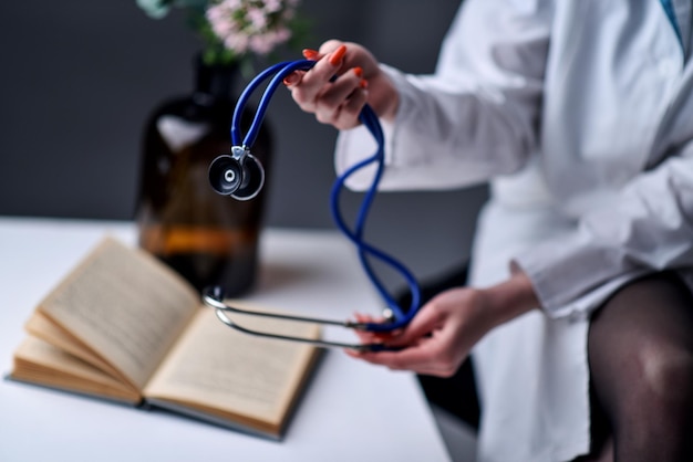 A stethoscope in the hands of the doctor