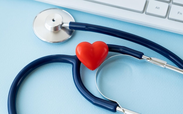 Stethoscope Heart Keyboard And Notepad On Tile Background