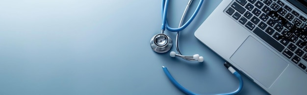 Stethoscope and Laptop on a Blue Surface