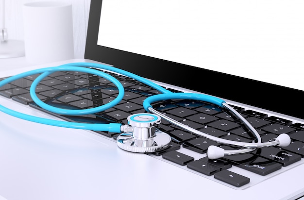 Photo stethoscope on laptop keyboard