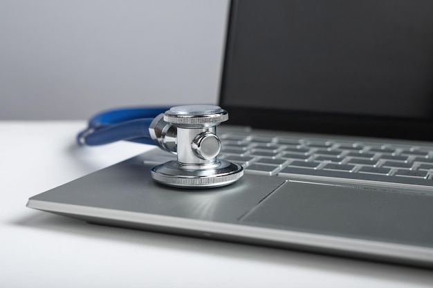 Stethoscope on laptop Telemedicine telehealth concept Remote clinical services to patients Online health care