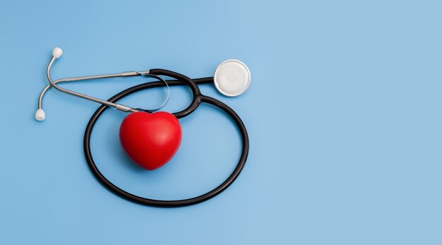 Stethoscope and red hearts on a blue background Health care concept.