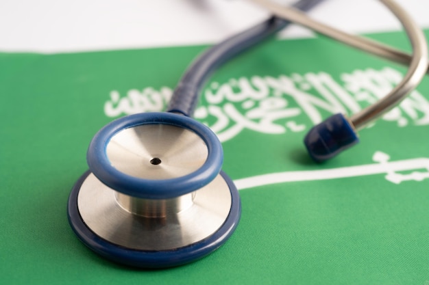 Stethoscope on Saudi arabia flag background Business and finance concept