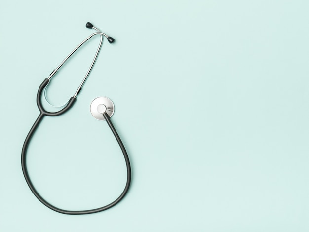 Stethoscope and space for text on color background