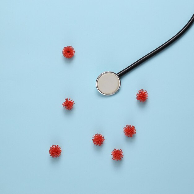 Stethoscope with molecules of virus strains on blue background