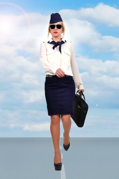 Stewardess walking on runway