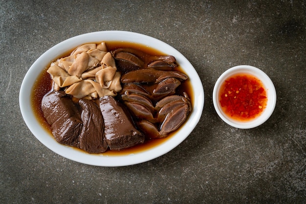 Stewed duck offal in brown soup