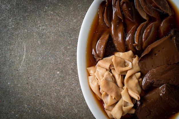 Stewed duck offal in brown soup