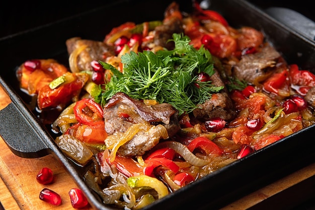 Stewed lamb with vegetables in a frying pan With selective focus