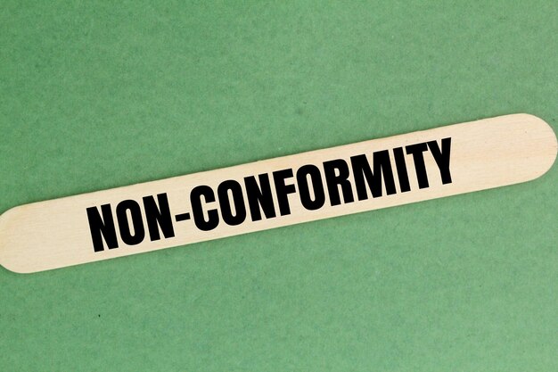 Photo stick to the word nonconformity the concept of ethics or rules