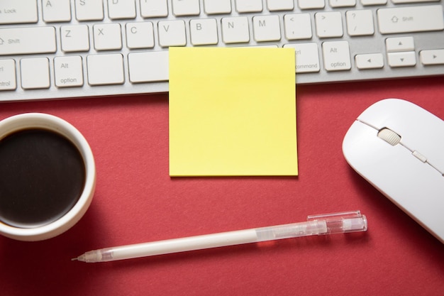 Sticky note with a keyboard and business objects