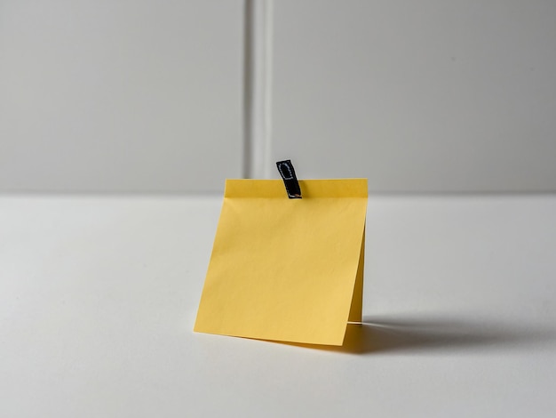 Sticky note with no writing on white