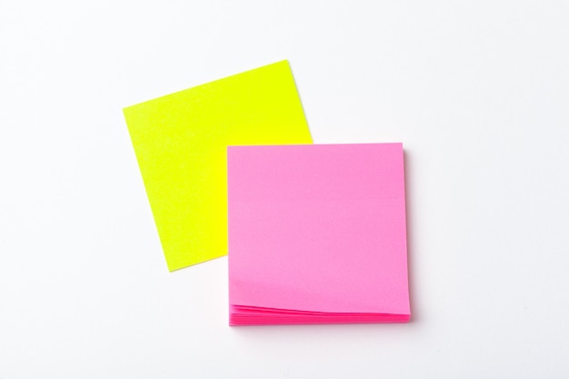 Sticky notes of bright colors close up on paper . School or business concept