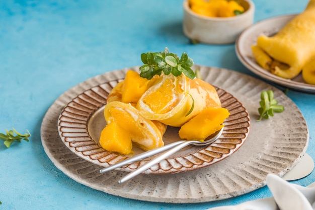 Sticky rice and mango crepe cake roll , 
Hong Kong , Thai food style in summer