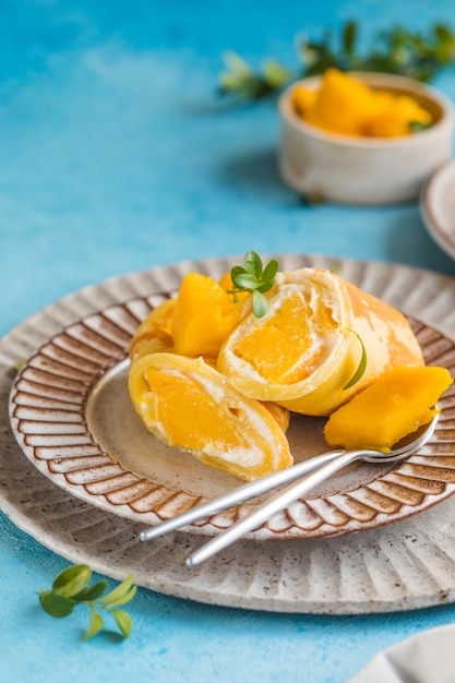 Sticky rice and mango crepe cake roll , 
Hong Kong , Thai food style in summer