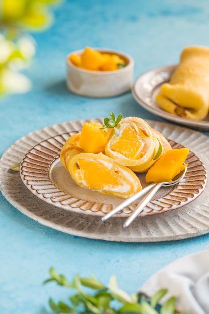 Sticky rice and mango crepe cake roll , 
Hong Kong , Thai food style in summer