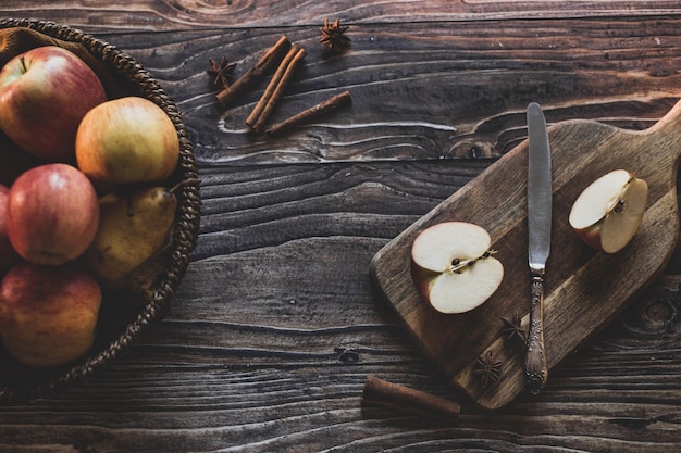 Still life apples in a wicker basket on a wooden table