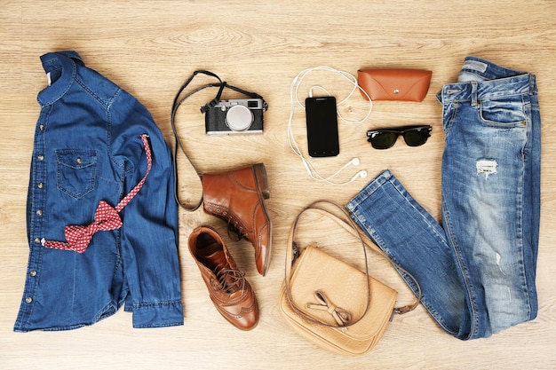 Still life of casual woman Woman clothes and accessories on wooden background