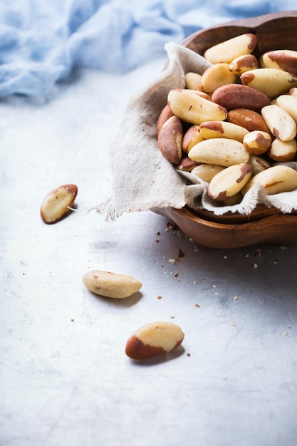 Still life food and drink heathy nutrition concept Portion of organic healthy brazil nuts on a rustic table selenium source Copy space background