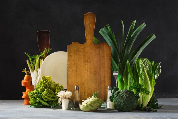 Still life kitchen board with fresh vegetables . Healthy food concept